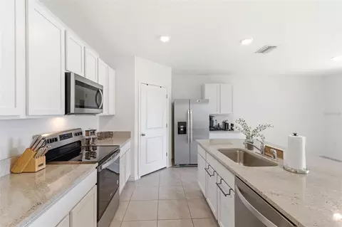 Kitchen - 9014 Forge Breeze Loop, Wesley Chapel, FL 33545 photo 2 of 9