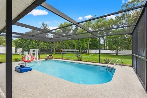 Exterior - 11201 Rainbow Woods Loop, Spring Hill, FL 34609 photo 6 of 18