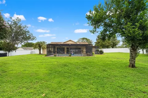 Exterior - 11201 Rainbow Woods Loop, Spring Hill, FL 34609 photo 9 of 18