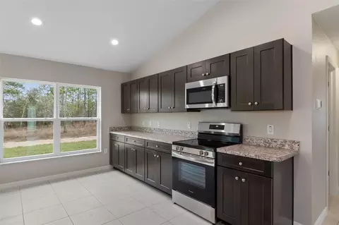Kitchen - 12073 Manassas Ave, Weeki Wachee, FL 34614 photo 3 of 3