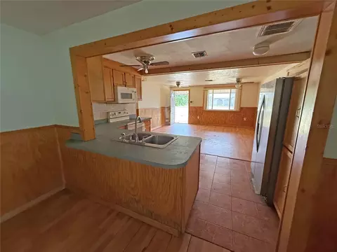 Living - 6134 Pinehurst Dr, Spring Hill, FL 34606 photo 4 of 8