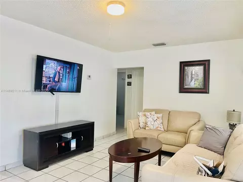 Living - 451 E 60th St, Hialeah, FL 33013 photo 3 of 4