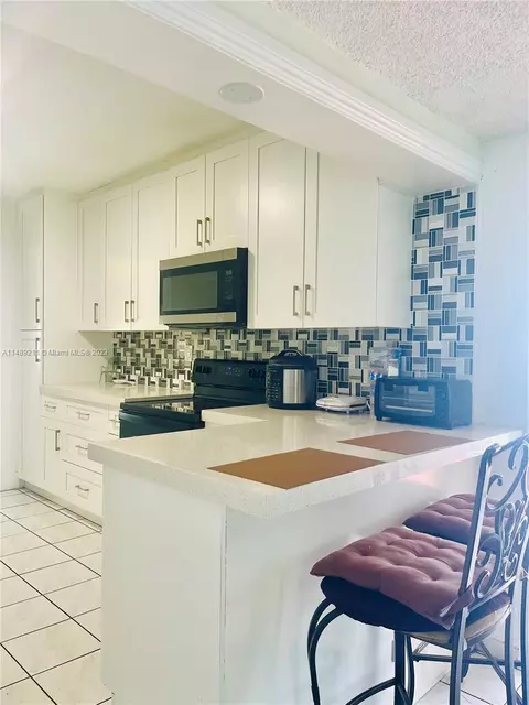 Kitchen - 451 E 60th St, Hialeah, FL 33013 photo 3 of 4
