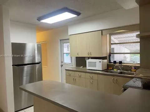 Kitchen - 1365 W 63rd St, Hialeah, FL 33012 photo 2 of 3