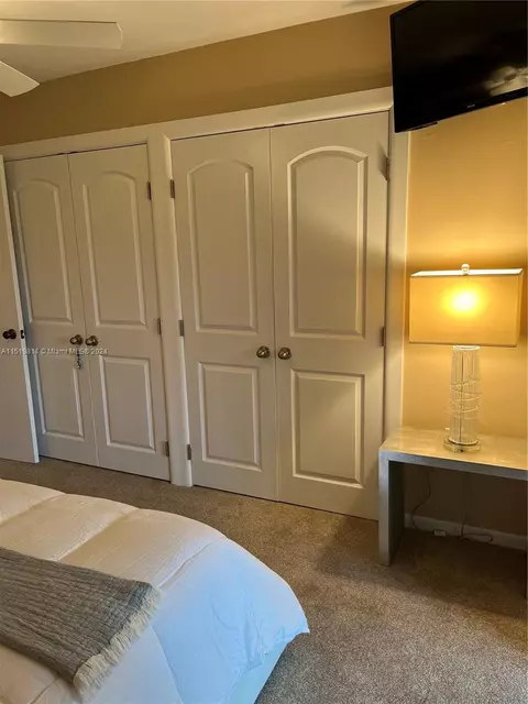 Bedroom - 5463 SE Miles Grant Rd #B211, Stuart, FL 34997 photo 4 of 4