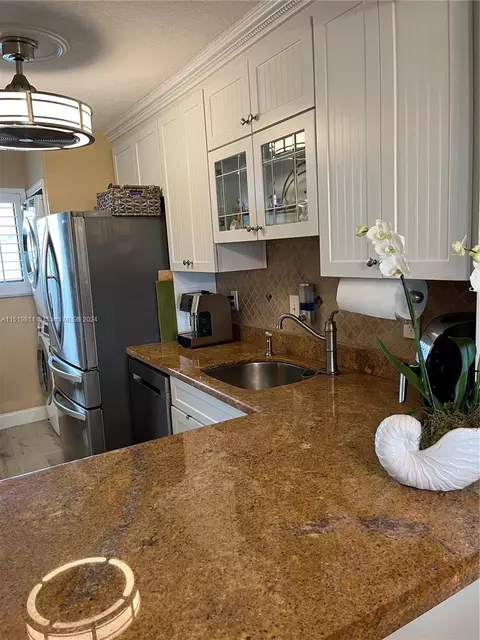 Kitchen - 5463 SE Miles Grant Rd #B211, Stuart, FL 34997 photo 6 of 7