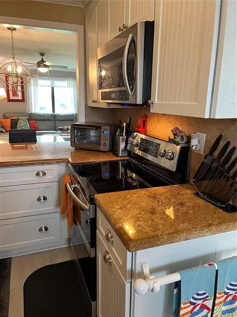 Kitchen - 5463 SE Miles Grant Rd #B211, Stuart, FL 34997 photo 4 of 7