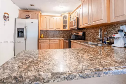 Kitchen - 437 E 56th St, Hialeah, FL 33013 photo 3 of 3