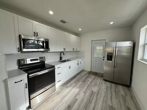 Kitchen - 825 Codadad St, Opa Locka, FL 33054 photo 3 of 4