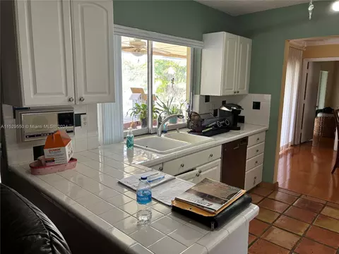 Kitchen - 14510 S Dade Pine Ave, Miami Lakes, FL 33014 photo 1 of 2