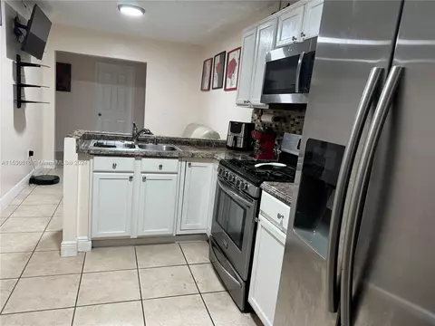 Kitchen - 1179 W 40th Pl, Hialeah, FL 33012 photo 3 of 4