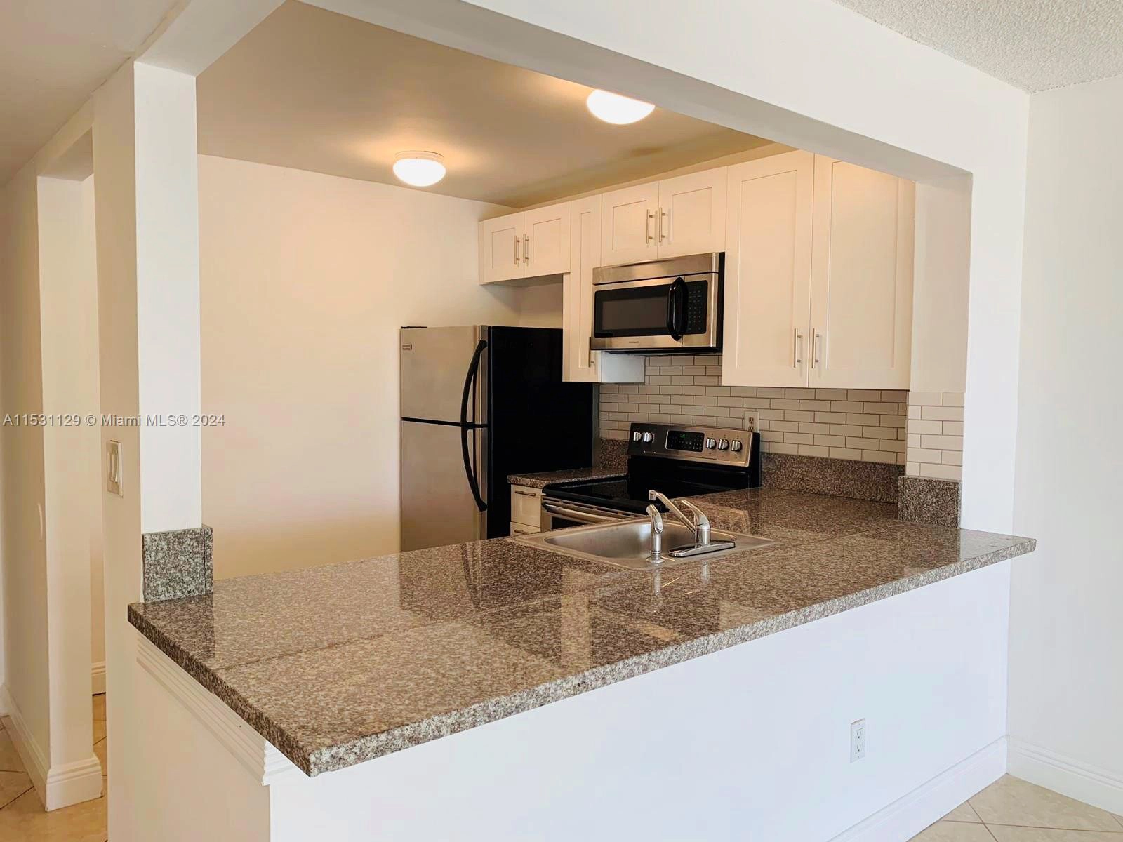 492 NW 165th St Rd Unit C-309  