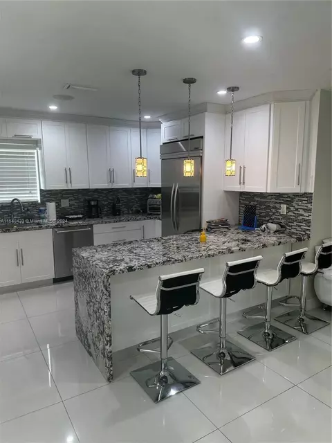 Kitchen - 630 W 50th Pl, Hialeah, FL 33012 photo 2 of 4