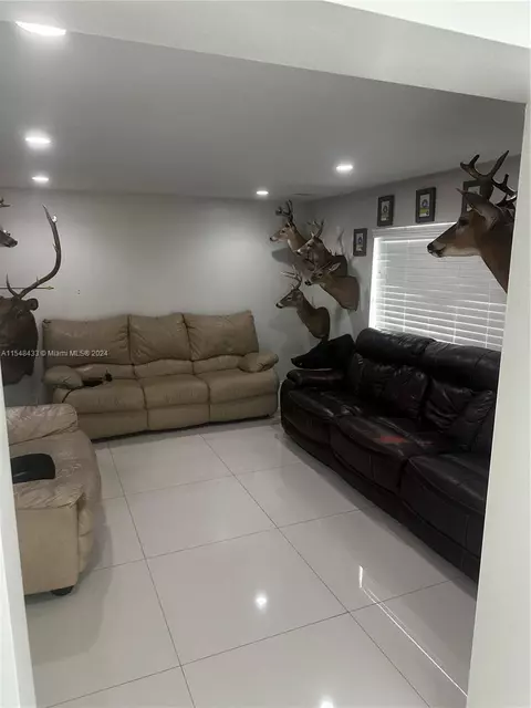 Living - 630 W 50th Pl, Hialeah, FL 33012 photo 2 of 3