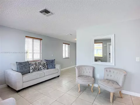 Living - 4351 E 8th Ln, Hialeah, FL 33013 photo 6 of 9