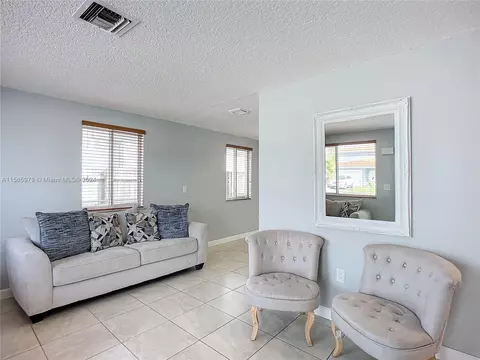 Living - 4351 E 8th Ln, Hialeah, FL 33013 photo 4 of 9