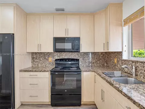 Kitchen - 151 E 52nd Pl, Hialeah, FL 33013 photo 2 of 2