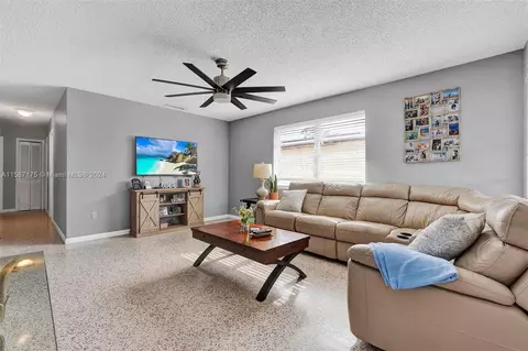 Living - 331 E 56th St, Hialeah, FL 33013 photo 2 of 3