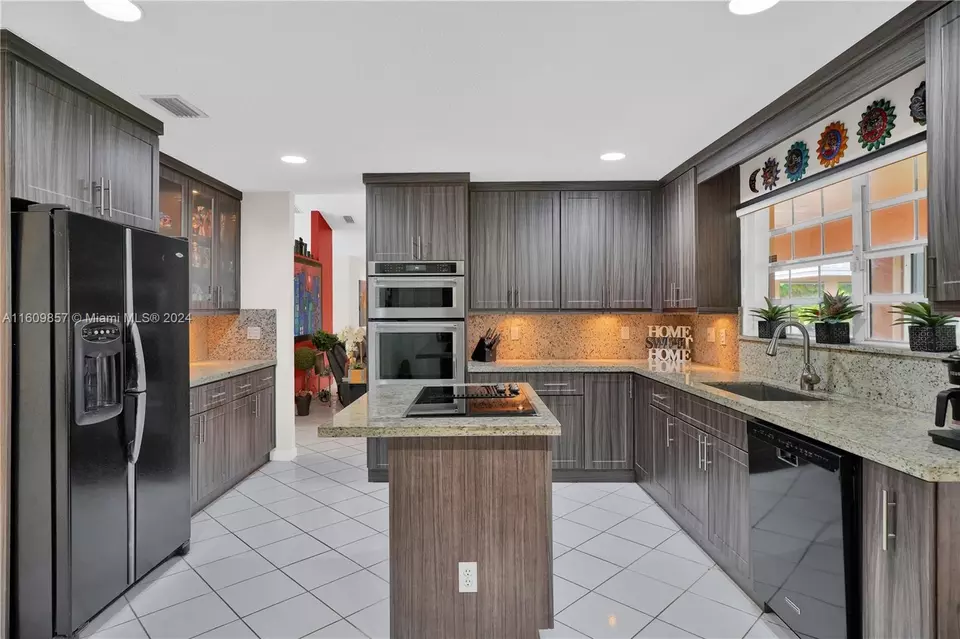 Kitchen - 15765 SW 153rd Ct, Miami, FL 33187 photo 1 of 4