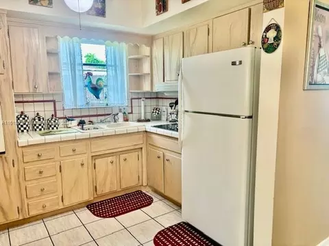 Kitchen - 5490 W 12th Ln, Hialeah, FL 33012 photo 1 of 3