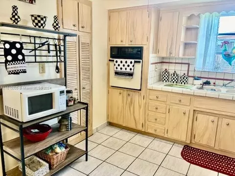 Kitchen - 5490 W 12th Ln, Hialeah, FL 33012 photo 2 of 3
