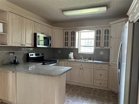 Kitchen - 720 SE 8th Pl, Hialeah, FL 33010 photo 1 of 2