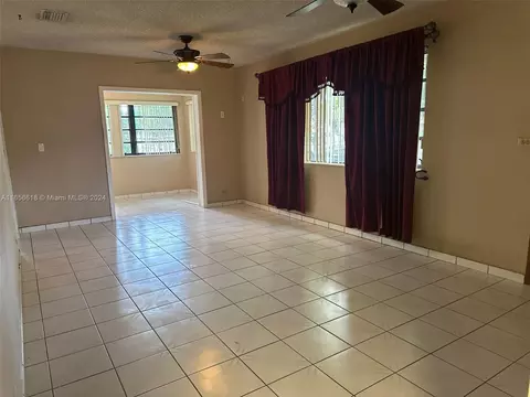Living - 4080 W 7th Ln, Hialeah, FL 33012 photo 2 of 4