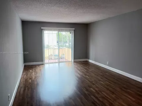 Living - 18101 NW 68th Ave #D210, Hialeah, FL 33015 photo 1 of 3