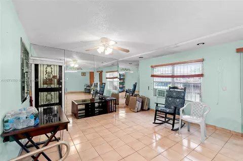 Living - 551 E 37th St, Hialeah, FL 33013 photo 3 of 4