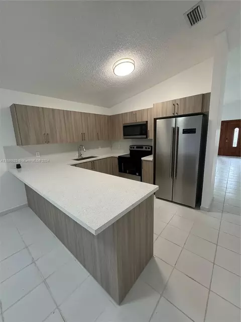 Kitchen - 3127 W 69th Pl, Hialeah, FL 33018 photo 1 of 3