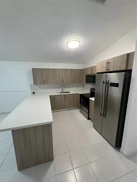Kitchen - 3127 W 69th Pl, Hialeah, FL 33018 photo 2 of 3
