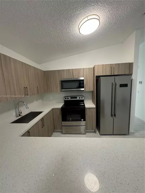 Kitchen - 3127 W 69th Pl, Hialeah, FL 33018 photo 3 of 3