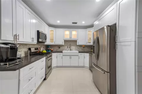 Kitchen - 496 W 46th Pl, Hialeah, FL 33012 photo 2 of 3