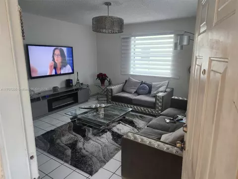 Living - 1725 W 58th St, Hialeah, FL 33012 photo 2 of 2