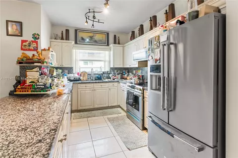 Kitchen - 7050 W 4th Ln, Hialeah, FL 33014 photo 1 of 2