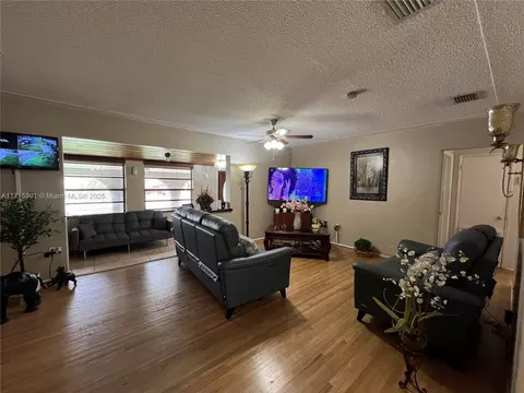 Living - 546 E 27th St, Hialeah, FL 33013 photo 2 of 2