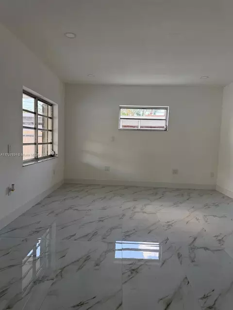 Living - 437 W 76th St, Hialeah, FL 33014 photo 2 of 4