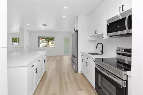 Kitchen - 720 NE 2nd Pl, Hialeah, FL 33010 photo 2 of 2