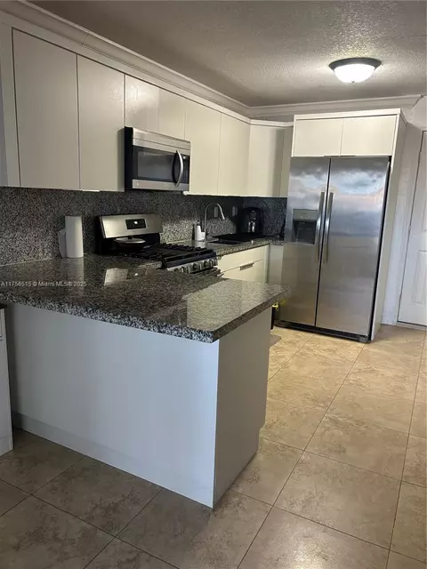 Kitchen - 831 E 13th St, Hialeah, FL 33010 photo 2 of 5