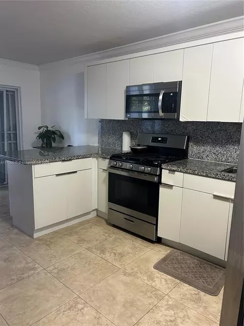 Kitchen - 831 E 13th St, Hialeah, FL 33010 photo 3 of 5