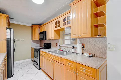Kitchen - 390 E 44th St, Hialeah, FL 33013 photo 2 of 4