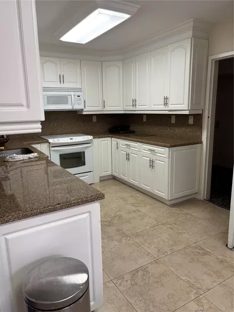 Kitchen - 10777 W Sample Rd #714, Coral Springs, FL 33065 photo 4 of 10