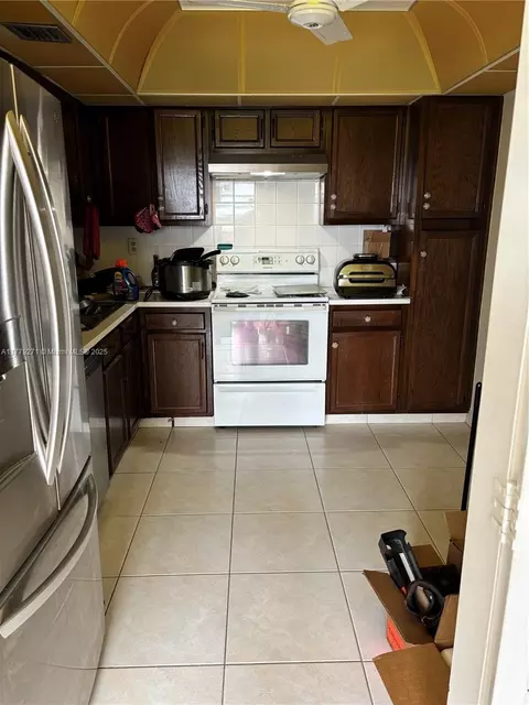 Kitchen - 10777 W Sample Rd #714, Coral Springs, FL 33065 photo 9 of 10