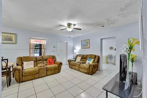 Living - 220 E 61st St, Hialeah, FL 33013 photo 2 of 2