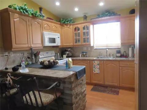 Kitchen - 10017 W Okeechobee Rd #202, Hialeah Gardens, FL 33016 photo 1 of 2