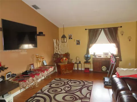 Living - 10017 W Okeechobee Rd #202, Hialeah Gardens, FL 33016 photo 1 of 2