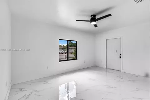 Living - 4660 W 8th Pl, Hialeah, FL 33012 photo 6 of 7