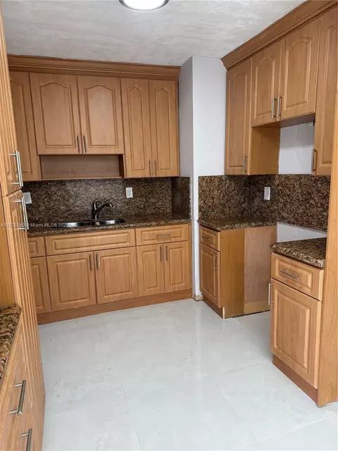 Kitchen - 954 W 72nd Pl, Hialeah, FL 33014 photo 2 of 2