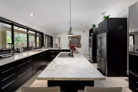 Kitchen - 1000 E Cypress Dr, Pompano Beach, FL 33069 photo 2 of 4