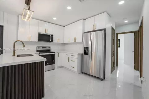 Kitchen - 301 W 30th St, Hialeah, FL 33012 photo 1 of 3